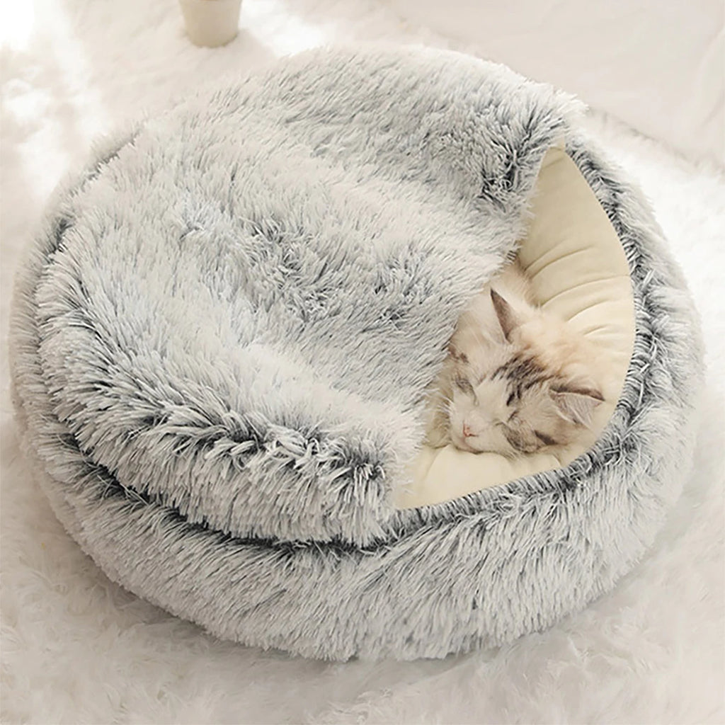 A warm and fluffy hooded pet bed designed to give cats and small dogs a cozy, secure place to rest and sleep
