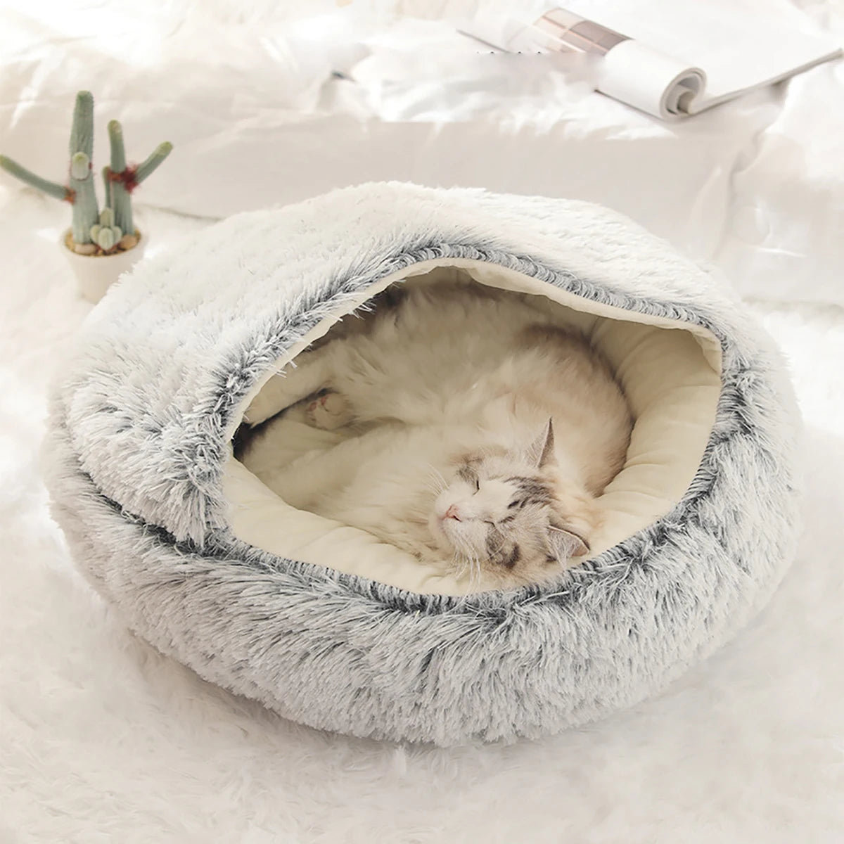 A warm and fluffy hooded pet bed designed to give cats and small dogs a cozy, secure place to rest and sleep